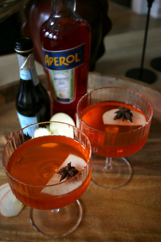 apple cider spritz cocktail on table
