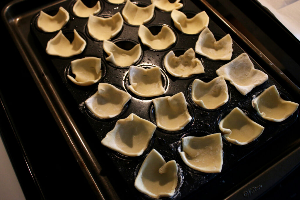 puff pastry squares in mini cupcake tin