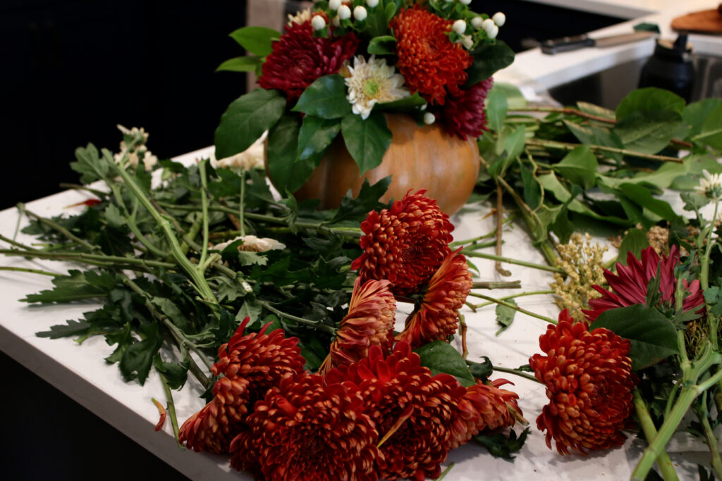 pumpkin floral arrangement on kitchen counter