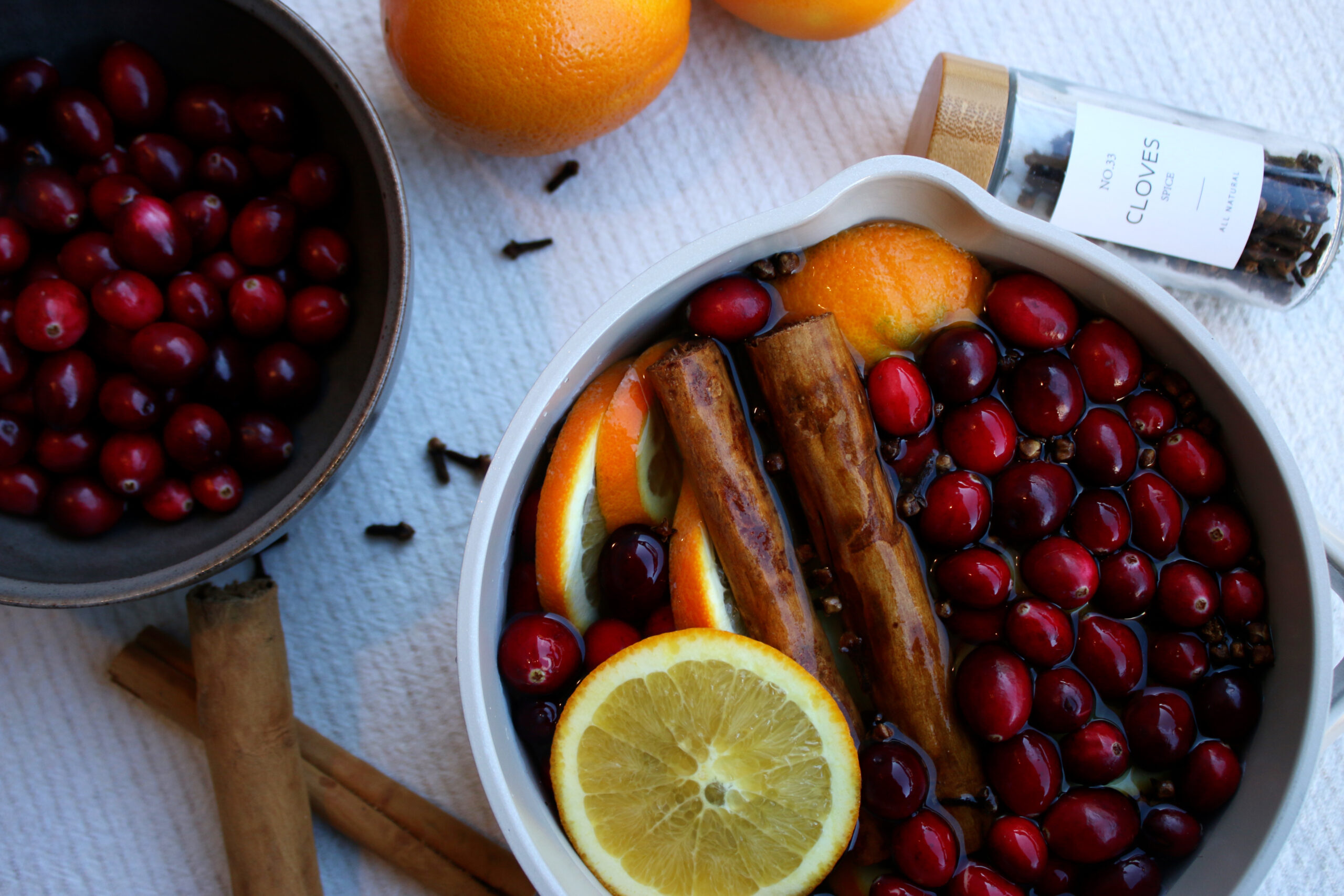 cranberries and orange slices in a simmer pot